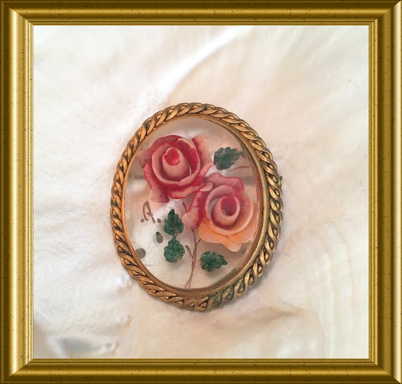 Antique reversed carved lucite flower brooch