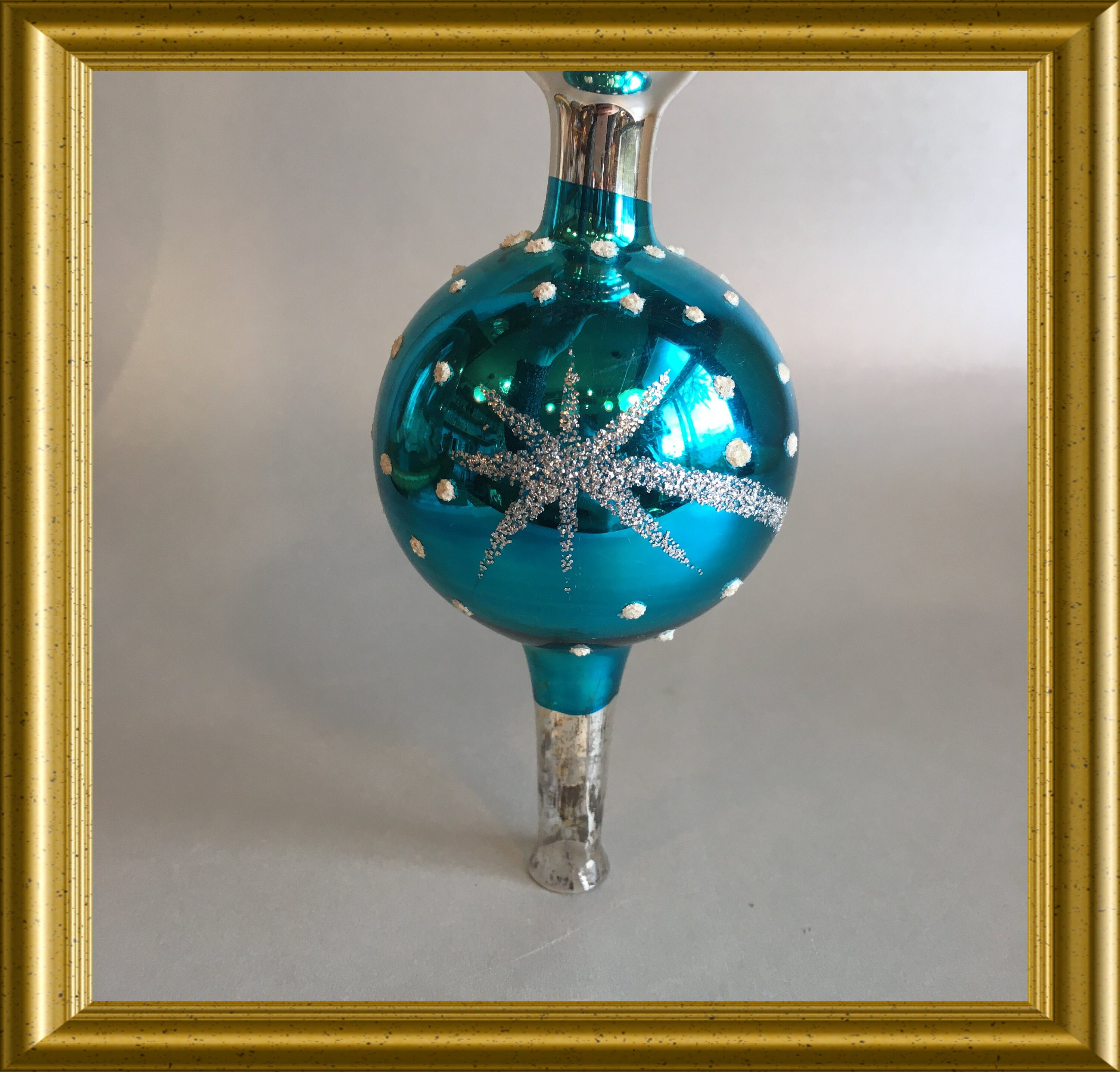 Vintage blue glass tree topper with a star, celestial tree topper