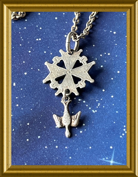 Small silver Huguenot cross pendant on necklace