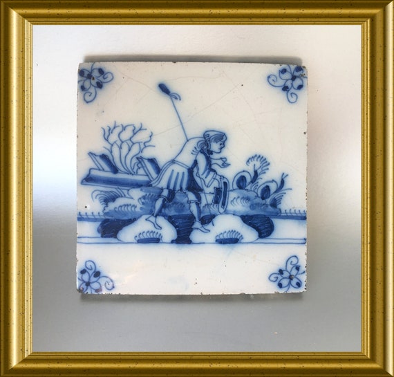 Antique glazed earthenware tile : shepherd