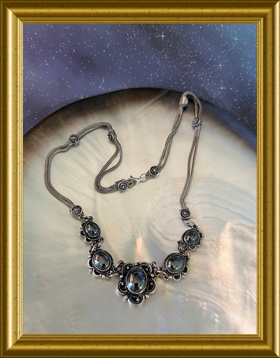 Silver necklace with gray stones