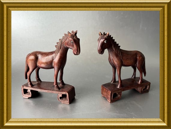 Two small Asian wooden horses