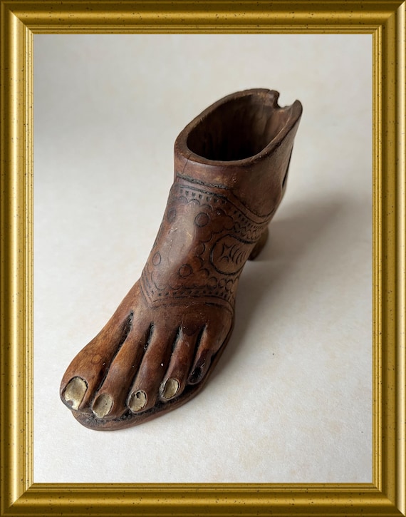 Vintage wood carving : wooden foot, shoe