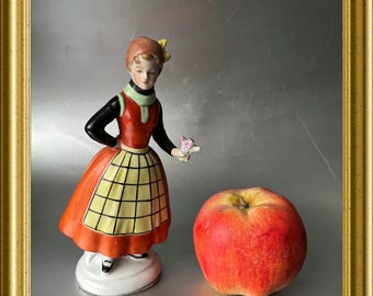 Antique porcelain figurine: woman with apron