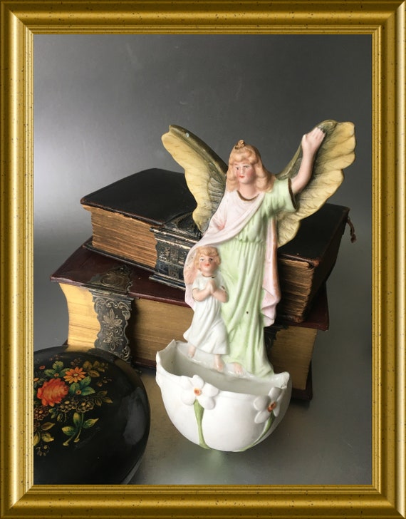 Antique porcelain holy water font: angel with child, guardian angel