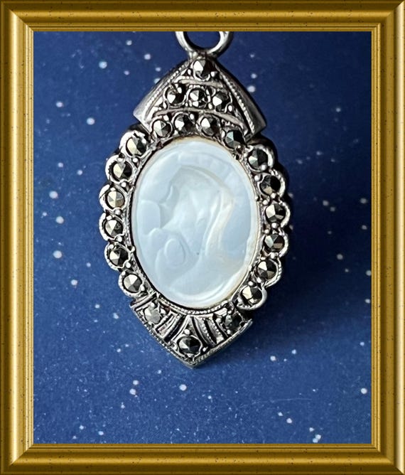 Old small silver pendant: marcasite, mother-of-pearl portrait