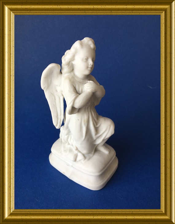 Antique bisque porcelain figurine: kneeling angel