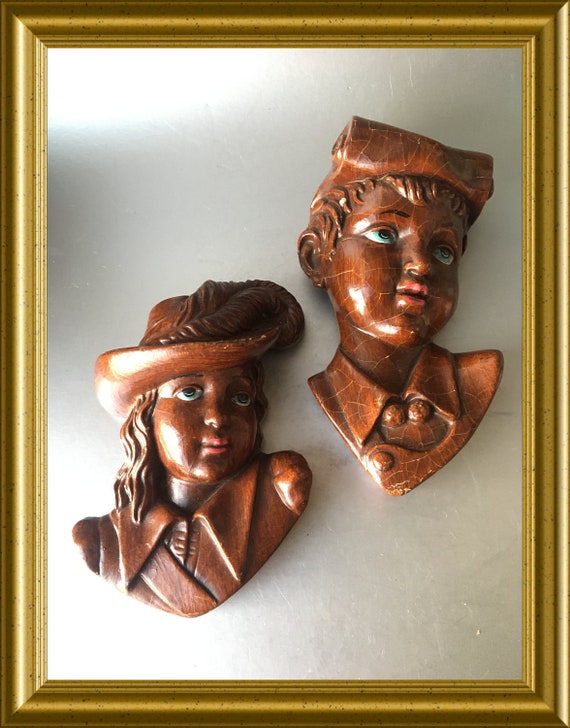 Two vintage Italian paper mache wall plaques: head boy and girl portrait wall masks