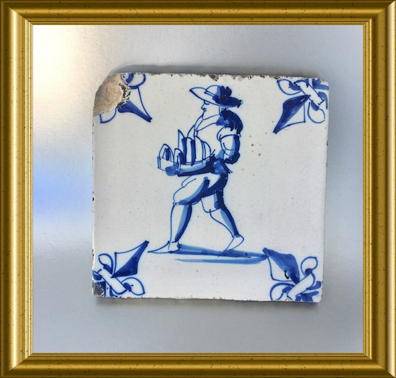 Antique glazed earthenware tile : merchant