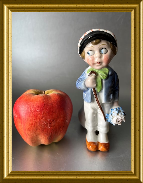 Lovely vintage porcelain boy with flowers figurine with small vase, 20's, googly eyes