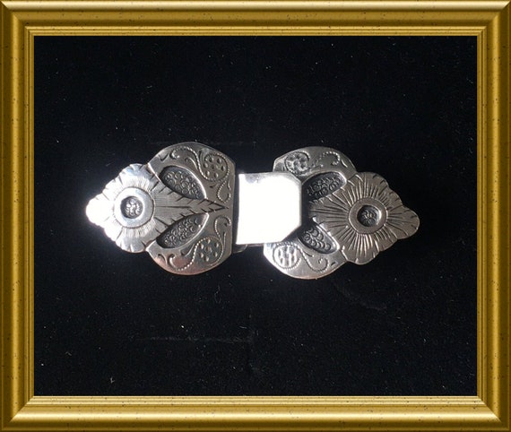 Small silver buckle, clasp, closure