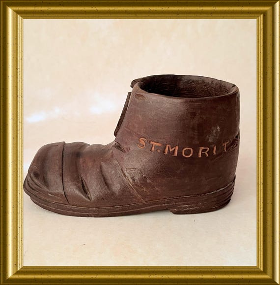 Vintage wood carving : wooden shoe from st. Moritz