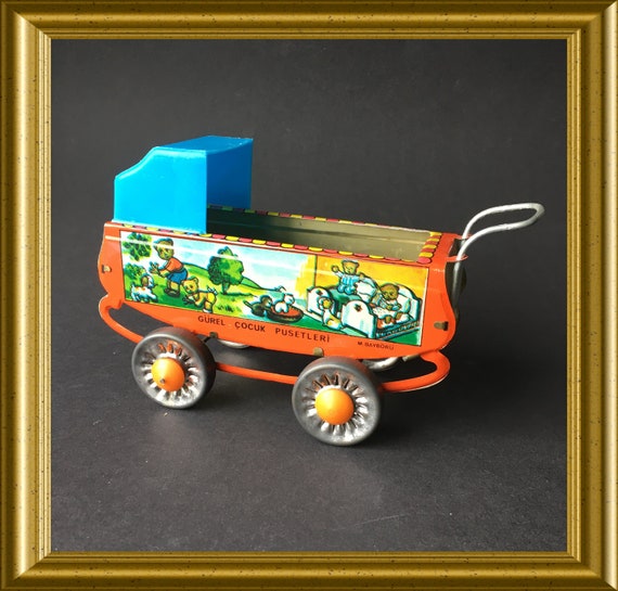 Vintage miniature tin plate pram