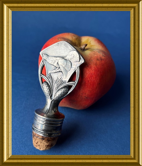 Vintage metal bottle stopper, wood grouse