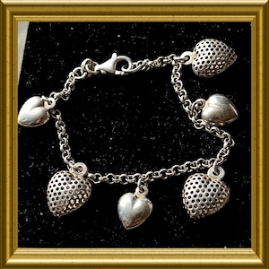 Vintage silver bracelet with heart charms