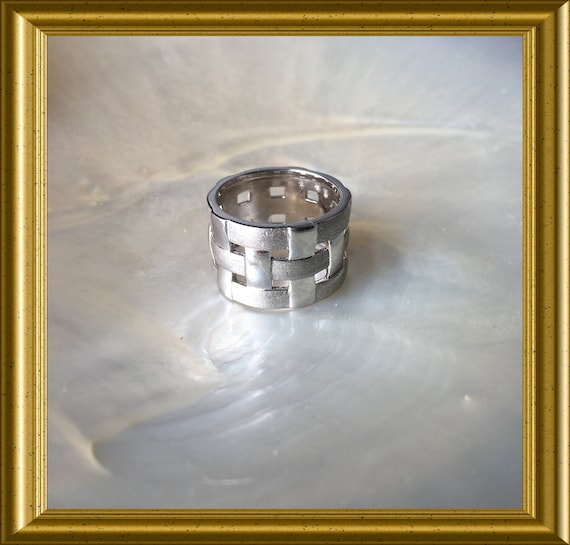 Beautiful woven silver ring, mat and shiny