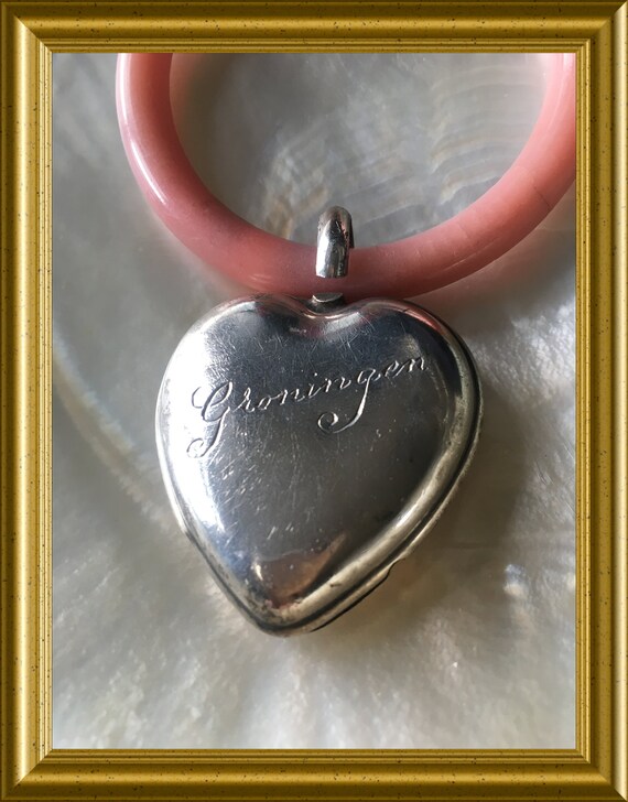 Vintage solid silver rattle with teething ring: heart, Groningen, initials P and V