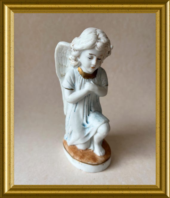 Antique bisque porcelain figurine: kneeling angel