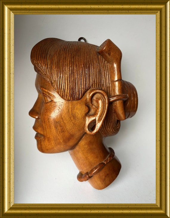 Vintage wood carving: wooden mask, head