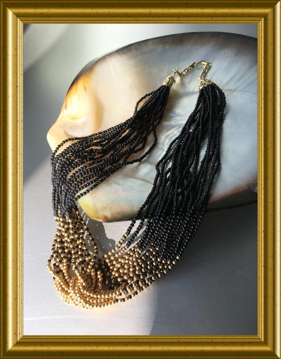 Necklace with black and 14‑carat gold beads