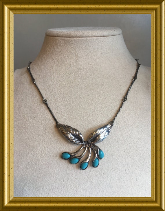 Silver necklace with turquoise blue stones