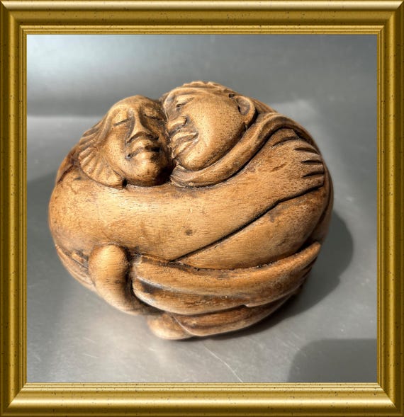 Vintage woodcarving, wooden figurine, hugging couple, embrace