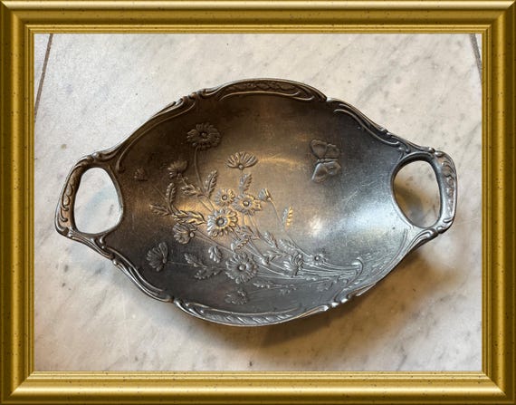 Vintage pewter dish with flowers and butterfly