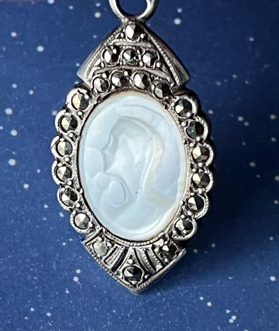 Old small silver pendant: marcasite, mother-of-pearl portrait