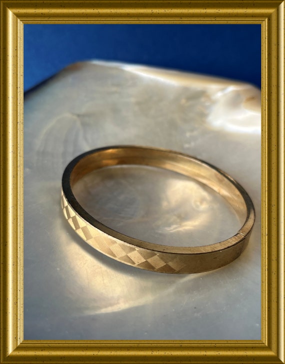 Vintage gold-plated bangle bracelet: Andreas Daub