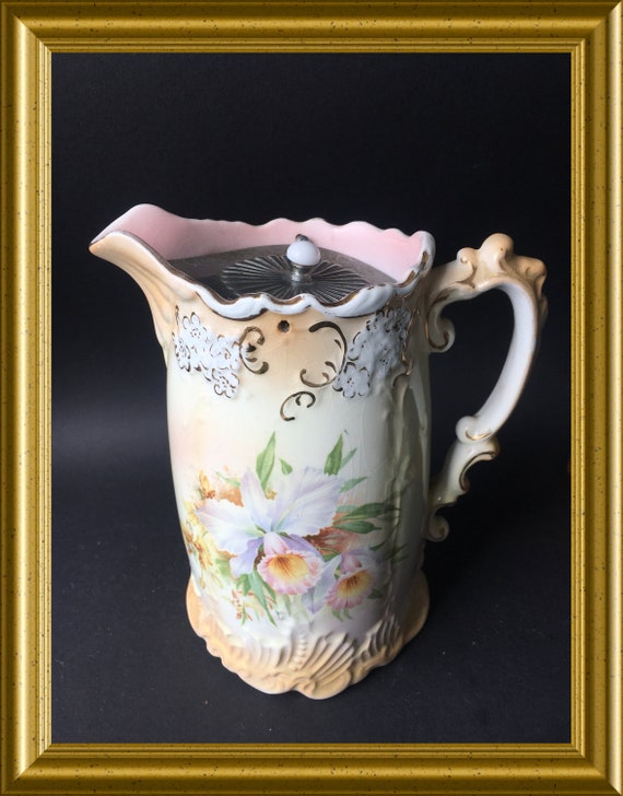 Antique English ceramic jug with pewter lid