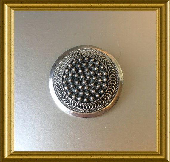 Vintage round silver brooch