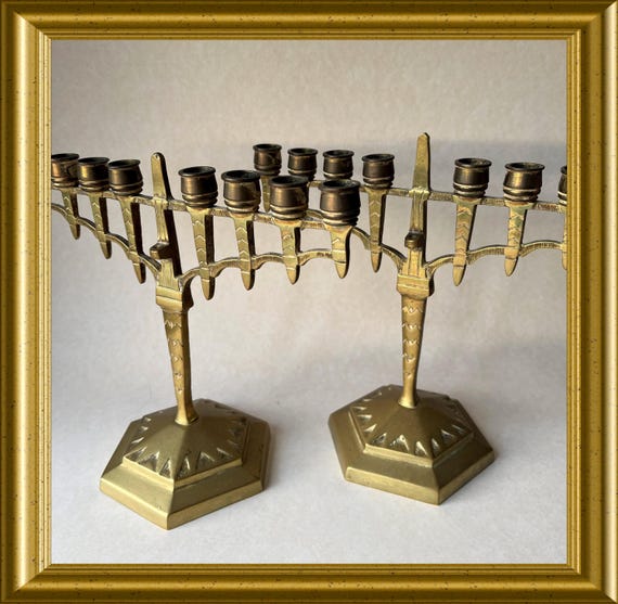 Two brass Jewish candlesticks: Hanukkiah