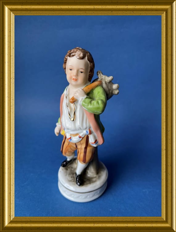 Vintage porcelain figurine: boy with knapsack, bindle