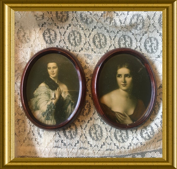 Two small vintage oval wooden frames: portrait