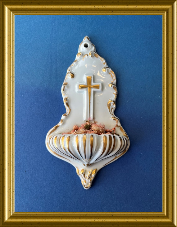 Antique white porcelain holy water font: crucifix, cross