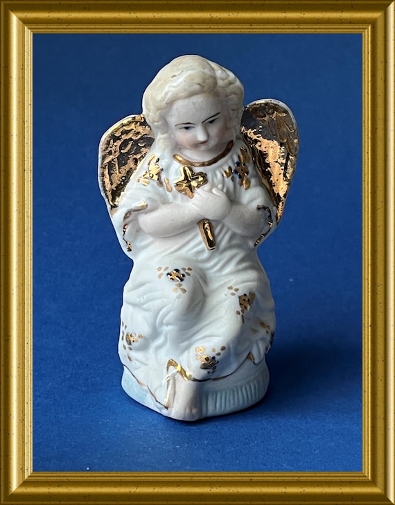 Antique small porcelain angel figurine