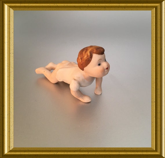 Vintage small porcelain figurine: crawling baby