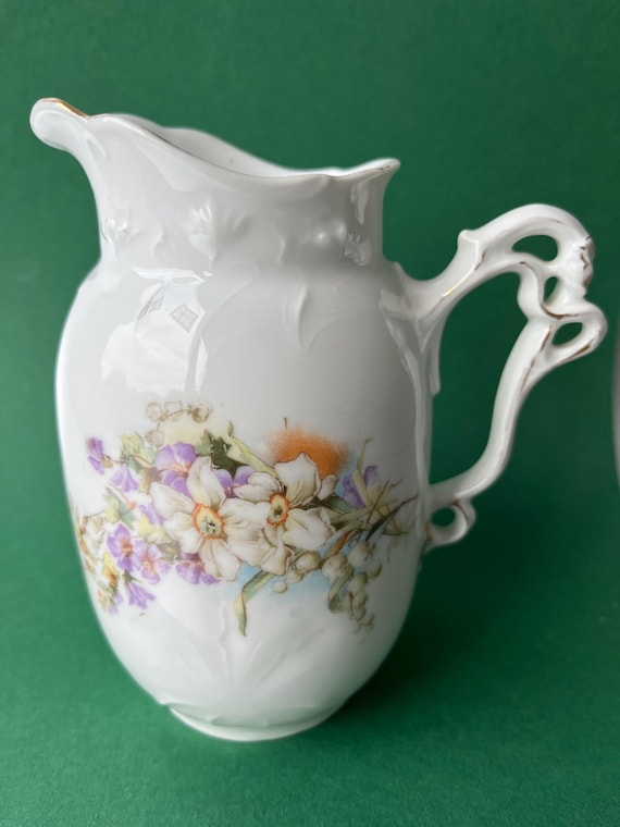 Art nouveau porcelain jug with floral decoration