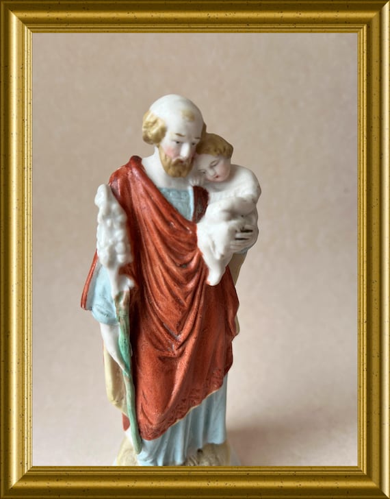Antique small porcelain figurine: Joseph with child Jesus