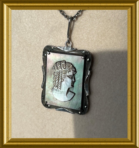 Old small silver pendant: marcasite, mother-of-pearl portrait cameo