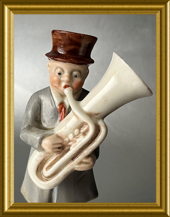 Antique small German porcelain figurine: man with tuba