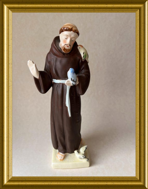 Old figurine: Saint Francis with birds