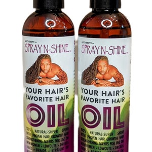 May include: Two 8-ounce bottles of hair oil labeled "Spray N-Shine Your Hair's Favorite Hair Oil". The bottles are brown glass with black spray tops and purple labels. The labels feature a man with dreadlocks and the text "100% Natural-Super Shine with Proven Hair Growth Hair Strengthening Agents for Use on Men/Women - Lowcuts - Dreads - Fades - Braids - Straight or Natural Hair". The bottles are labeled "Same Product, New Look!"