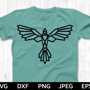 May include: A teal t-shirt with a geometric black bird design. The bird is stylized with sharp angles and a long tail.