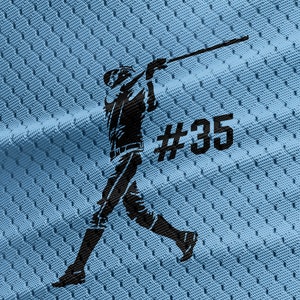 May include: A black silhouette of a baseball player swinging a bat on a light blue jersey with the number #35.