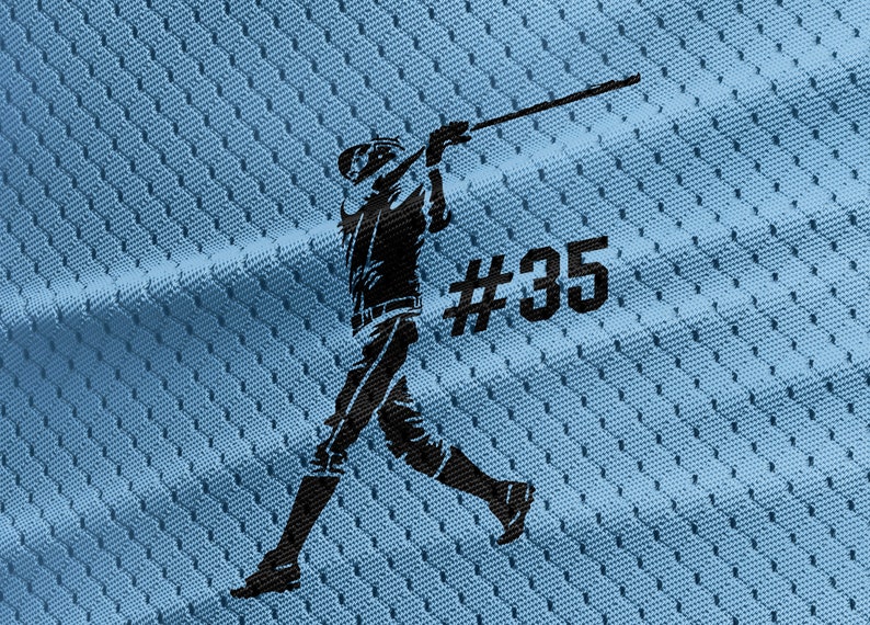May include: A black silhouette of a baseball player swinging a bat on a light blue jersey with the number #35.