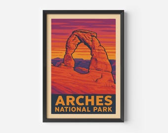 May include: Framed art print featuring a stylized illustration of Delicate Arch in Arches National Park. The artwork showcases the arch in shades of orange and red against a sunset sky, with the text "ARCHES NATIONAL PARK" at the bottom.