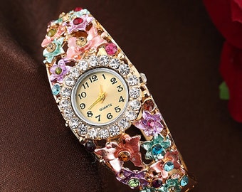 Enamel Flower Cuff Watch, Rhinestone Gold Tone Bracelet. Chick listing for additional colors, styles and designs.