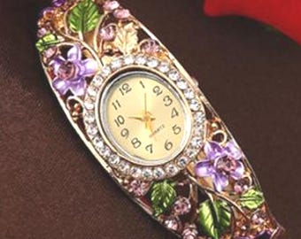 Enamel Flower Bracelet Watch, Rhinestone Gold Tone Cuff. Chick listing for additional colors, styles and designs.