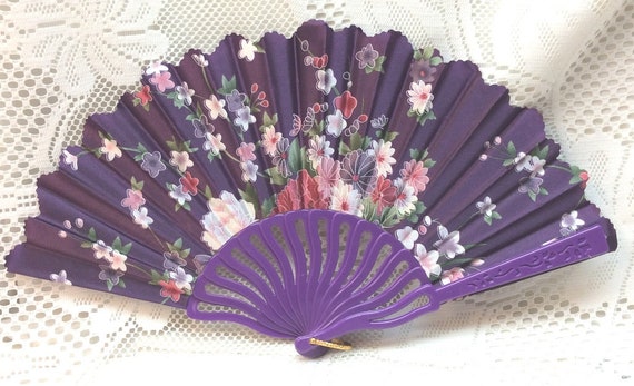 purple hand fan